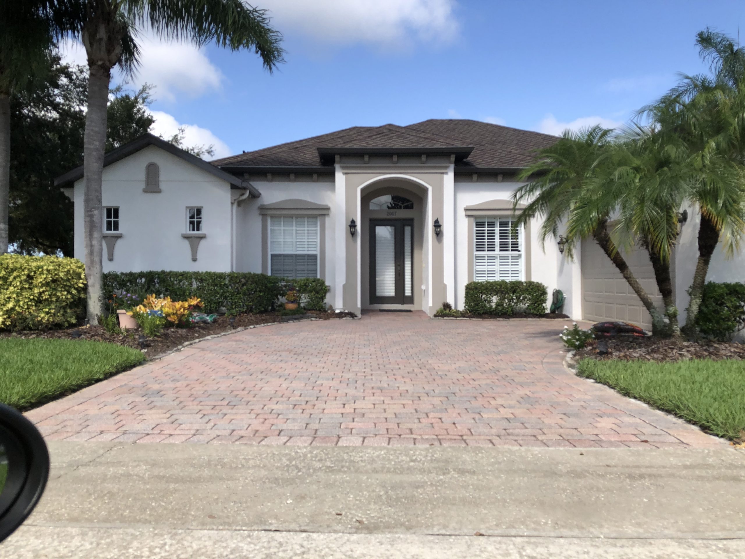 Exterior stucco repaint by Scollo Painting Inc. — West Palm Beach, FL